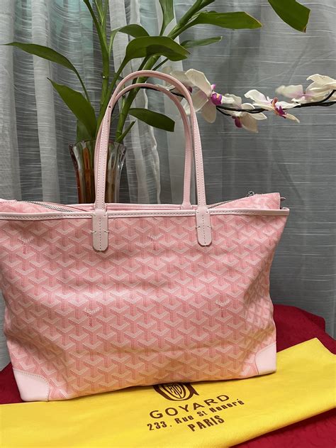 pink goyard luggage.